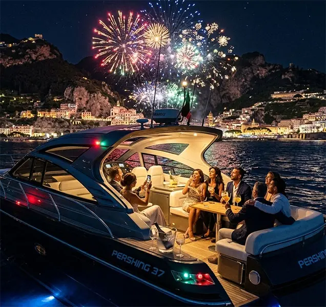 Guests watching a magical summer fireworks display from the deck of a luxury Pershing 37 motor yacht during a private night cruise along the Amalfi Coast.